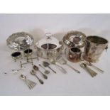 Collection of silver plate to include muffin warmer, ice bucket, carving rests, spoons etc