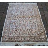Full pile ivory ground cashmere rug with all over floral design 170cm by 120cm