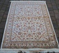 Full pile ivory ground cashmere rug with all over floral design 170cm by 120cm