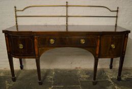 Large George III break front sideboard with brass rail on tapering legs with spade feet in