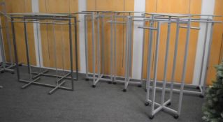 *6 glass topped clothes rails (4 on casters)