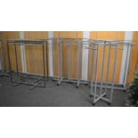 *6 glass topped clothes rails (4 on casters)