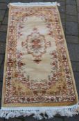 Gold ground small cashmere runner with floral pattern 143cm by 67cm