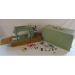 Musical Sunlik sewing machine includes attachments and instructions (no power or foot pedal)