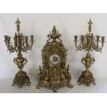 Large French brass clock garniture, with spring driven German chiming movement, height of candelabra