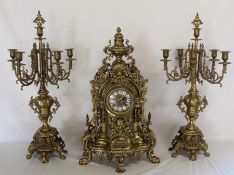 Large French brass clock garniture, with spring driven German chiming movement, height of candelabra