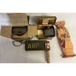1939 WWII ARP gas rattle, WWII solider doll, gas mask in a Barringer, Wallis & Manners tin box and