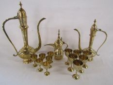 Collection of brass Dallah tea/coffee pots with brass cups