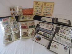 Collection of first day covers, postcards, collectors cards and loose stamps