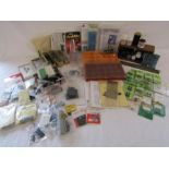 Collection of 00 gauge parts includes screws, springs, wheels, Humbrol Matt Cote etc