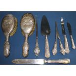 Selection of silver handled cutlery (bread knife not marked), silver handled glove stretchers,