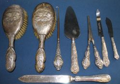 Selection of silver handled cutlery (bread knife not marked), silver handled glove stretchers,