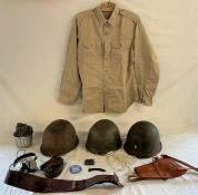 Militaria- 3 American helmets, shirt, badges etc