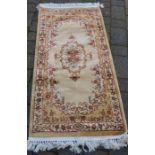 Gold ground small cashmere runner with floral pattern 143cm by 67cm