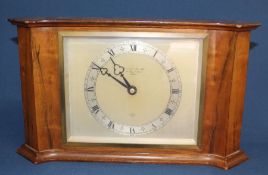 Elliott mantel clock marked Garrard & Co London with curved mahogany case and presentation plaque on