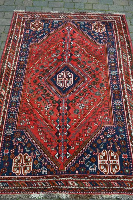 Blue and red Persian rug with central medallion 256cm x 166cm