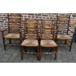 Six reproduction Georgian ladder back chairs with rush seats, including two carvers