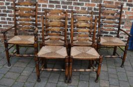 Six reproduction Georgian ladder back chairs with rush seats, including two carvers