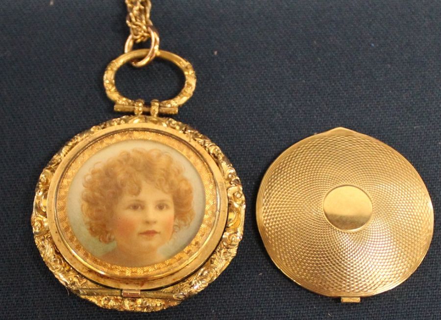 Pinchbeck locket on gold coloured chain containing miniature oil painting on ivorine panel depicting