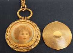 Pinchbeck locket on gold coloured chain containing miniature oil painting on ivorine panel depicting