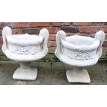 Pair of concrete two handled urns