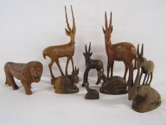 Wooden carved animals includes lion and gazelles