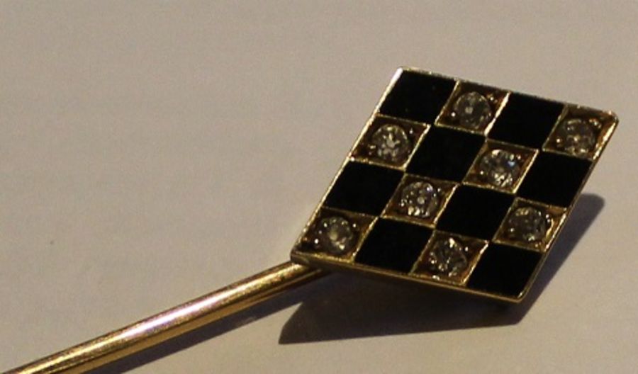 Tested as 18ct gold stick pin set with diamonds & black enamel in a checker board pattern 3.7g