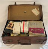 Leather effect suitcase containing variety of collectors cards, including animals, cars soldiers