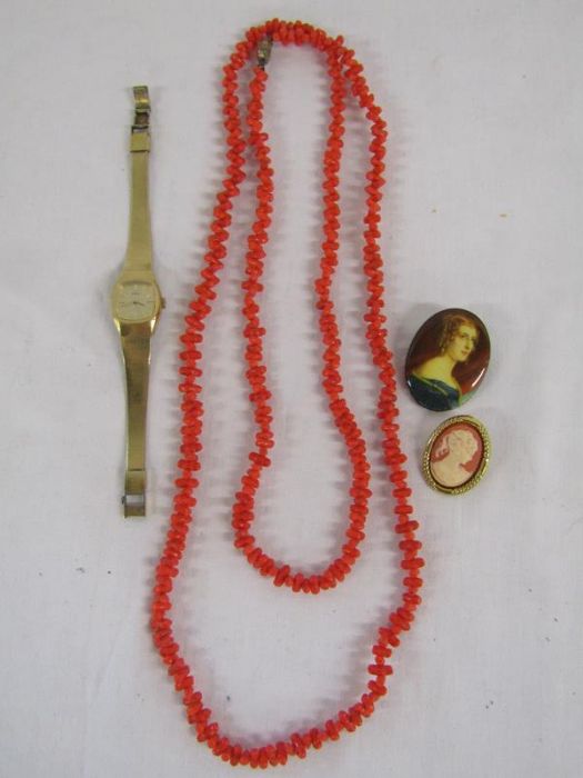Coral necklace, Seiko watch and brooches