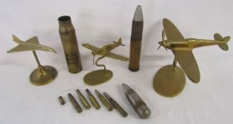 Brass aeroplanes on stands and shell casings