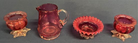 Selection of cranberry glass, including two salts, jug and dish