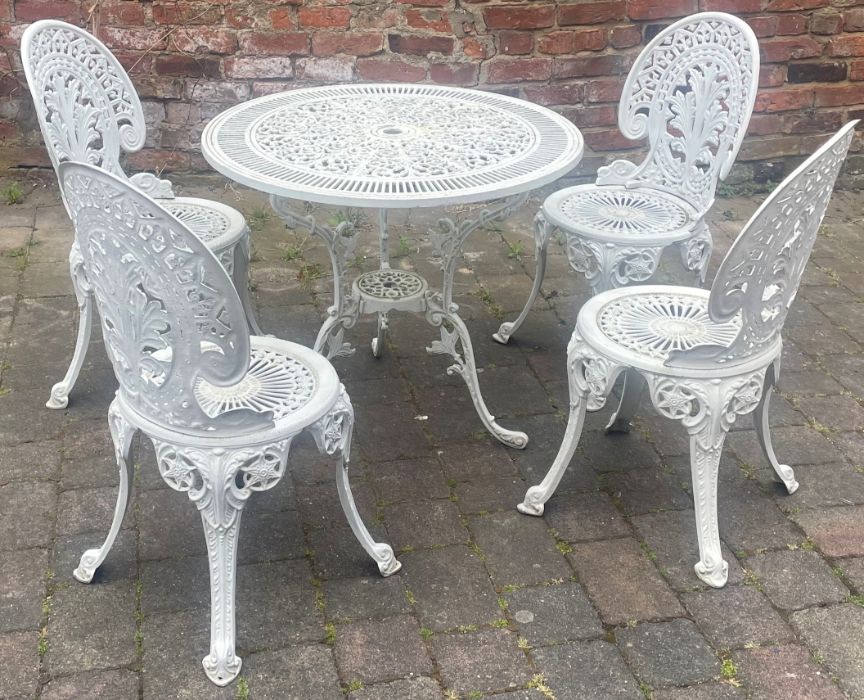 4 painted cast aluminium garden chairs and pierced decorative circular top table