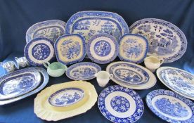 Mixed blue and white table ware including meat plates also green Poole jug
