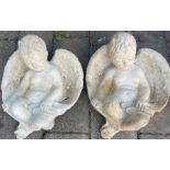 Two concrete 'Gabe' sleeping cherub Gabriels