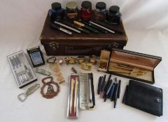 Small suitcase containing pens including Parker, Messenger in Shaeffer case, Shaeffer and Parker