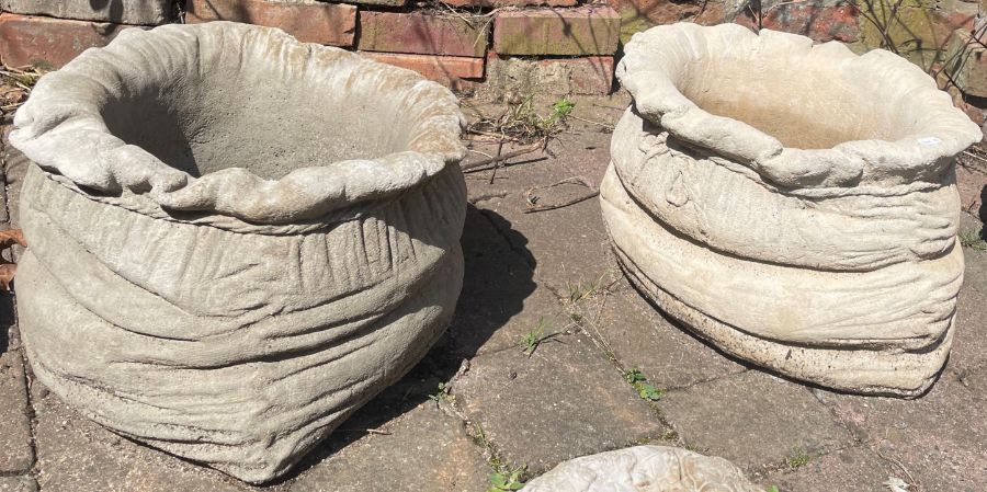 Large concrete sack shaped planters