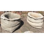 Large concrete sack shaped planters