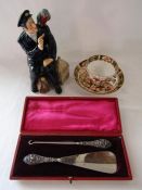 Royal Doulton 'Shore Leave' figure, Royal Crown Derby tea cup and saucer and silver handled shoe