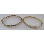 2 bi coloured 9ct gold bangles - gold twist bangle and overlap bangle - total weight 11.14g