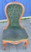 Victorian button back nursing chair in walnut on scroll legs with castors