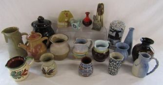 Collection of studio pottery jugs, vases and candle light holders