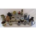 Collection of studio pottery jugs, vases and candle light holders