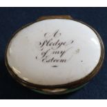 Late 18th / early 19th century oval enamel patch box, the hinged cover inscribed "A Pledge of My