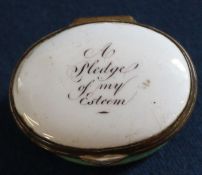 Late 18th / early 19th century oval enamel patch box, the hinged cover inscribed "A Pledge of My