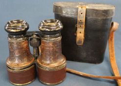Pair of military binoculars in leather case marked 1915 10 Lincoln with broad arrow mark (missing