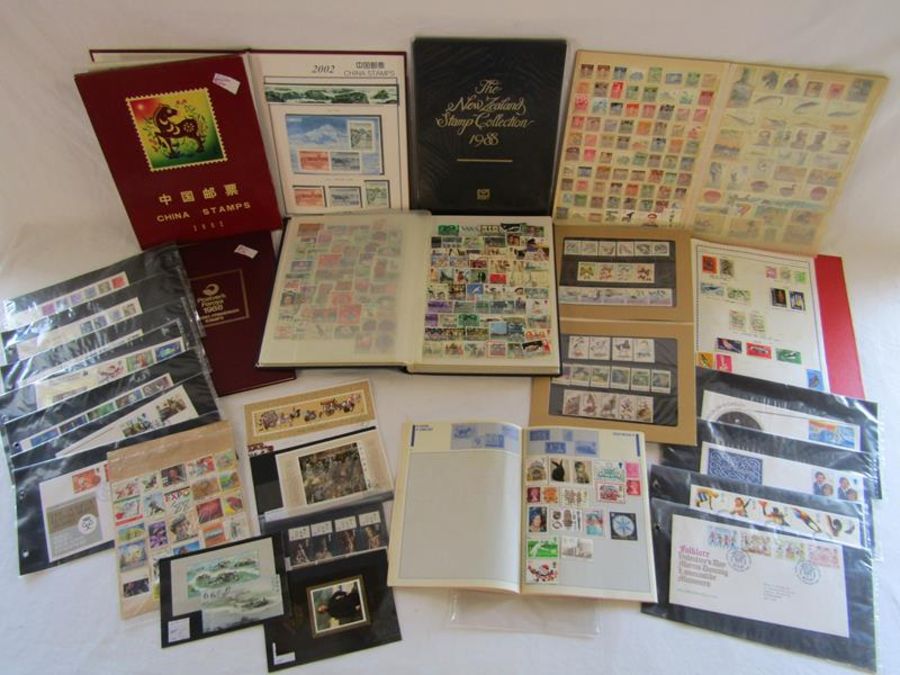 Collection of stamp albums includes The New Zealand stamp collection (still sealed), 2002 China