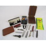 Collection of pipe tools, includes reamer, tampers, cigar and cigarette case also includes silver