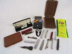 Collection of pipe tools, includes reamer, tampers, cigar and cigarette case also includes silver