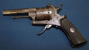 Pin fire revolver with engraving and chequered butt