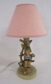 Goebel Hummel figural table lamp depicting a boy in an apple tree with a bird - marked 230 to base